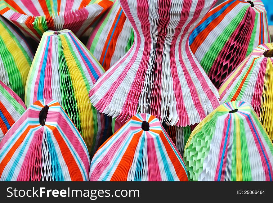 Colorful paper folding hats in a shop