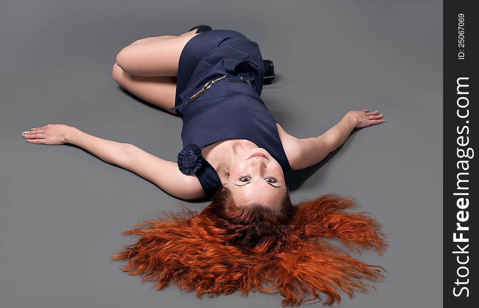 Redhead girl  posing in studio