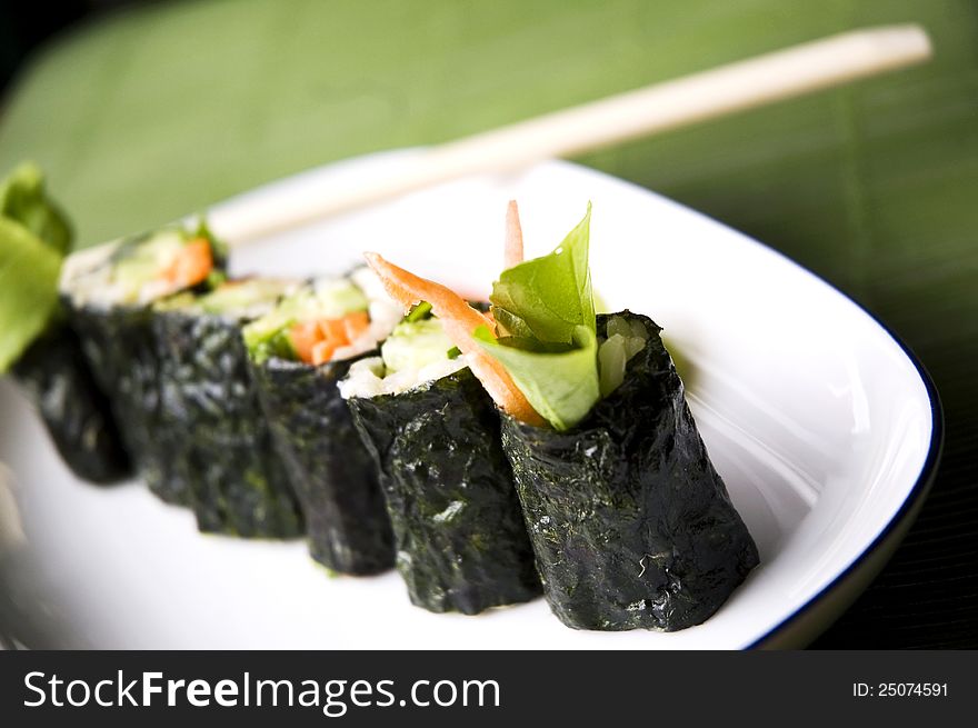 Close up vegetable in raw sushi roll healthy food. Close up vegetable in raw sushi roll healthy food