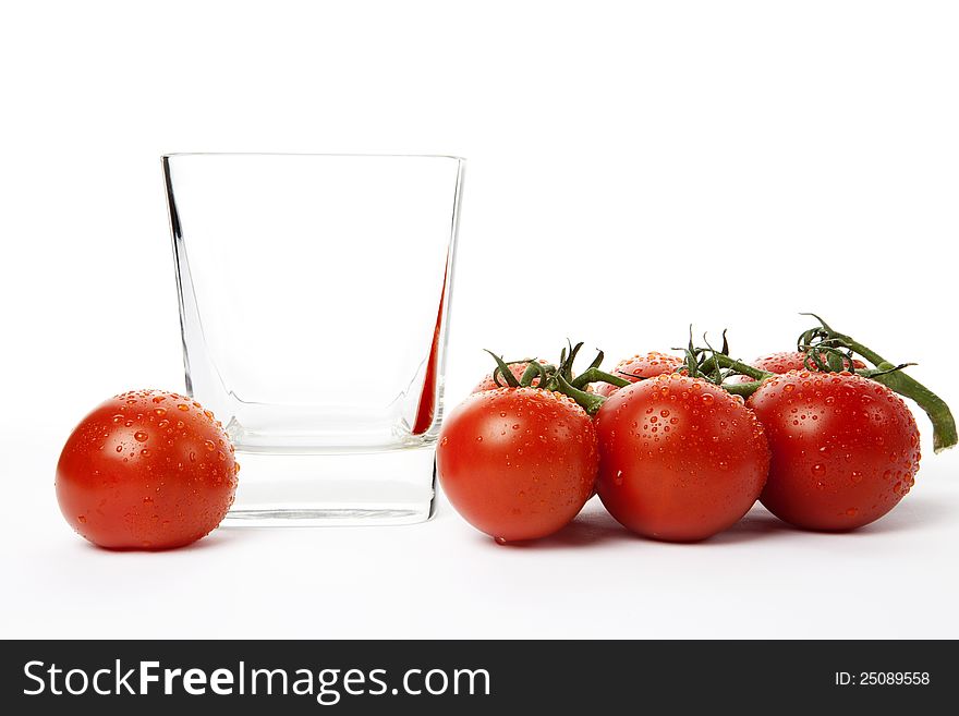 Fresh cherry tomatoes in a glass, isolated on white background