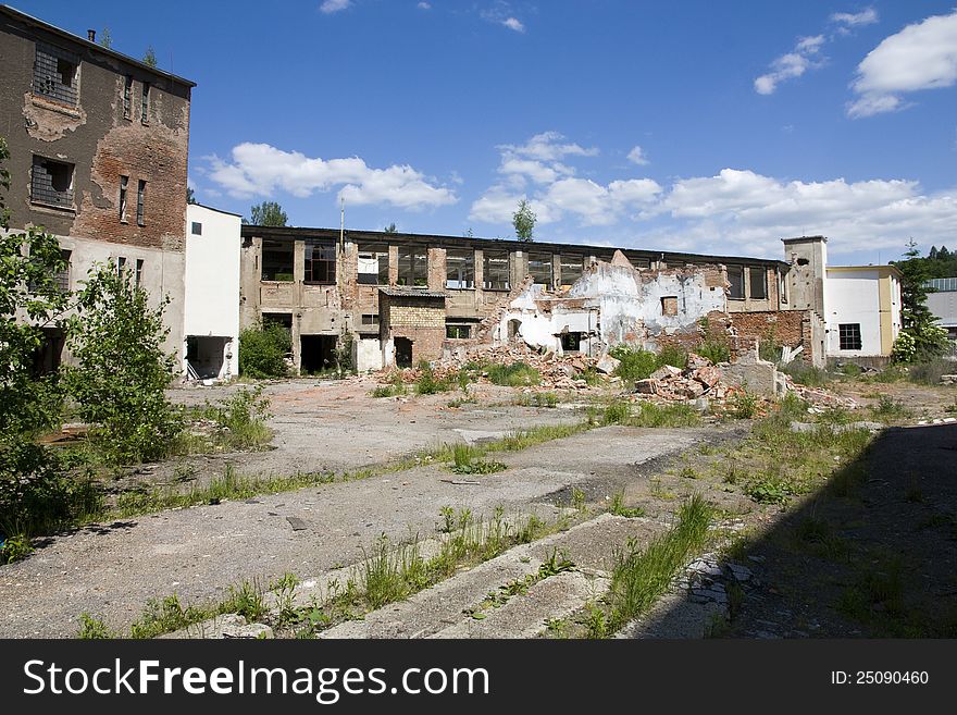 Complex of dilapidated buildings on a summer day. Complex of dilapidated buildings on a summer day