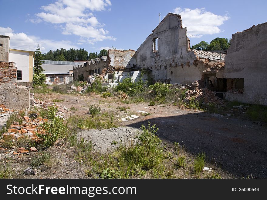 Complex of dilapidated buildings on a summer day. Complex of dilapidated buildings on a summer day