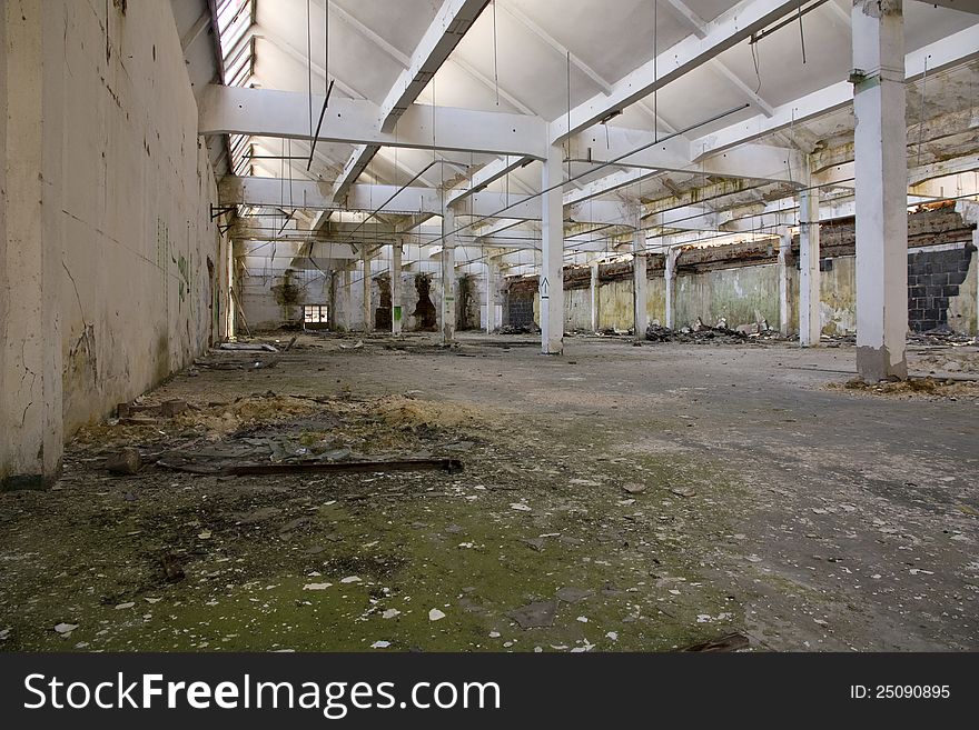 Devastated inside a former factory hall. Devastated inside a former factory hall