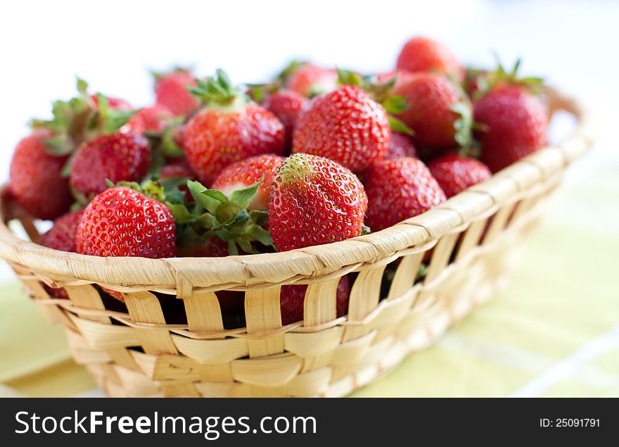 Ripe Strawberries In A Wooden Basket