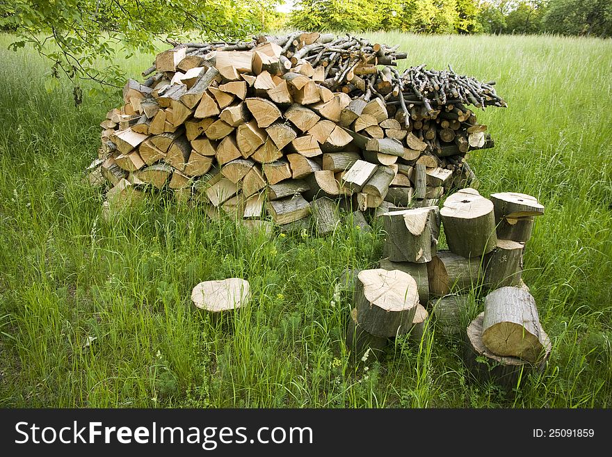 Stacked on a pile of wood and larger blocks in the foreground. Stacked on a pile of wood and larger blocks in the foreground