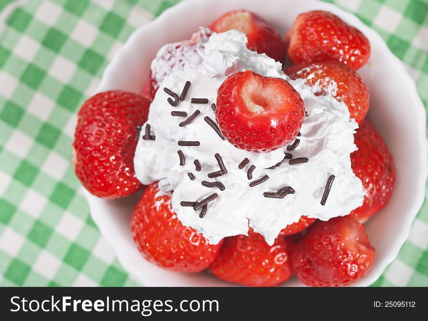 Delicious strawberries with cream,close up