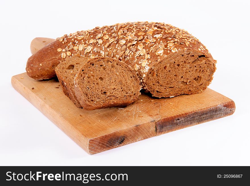 Dark bread on the board. Dark bread on the board