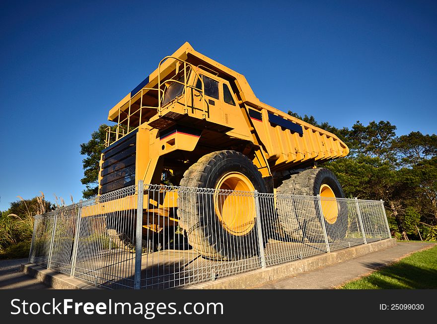 A very large dump truck used in the mining industry. A very large dump truck used in the mining industry.