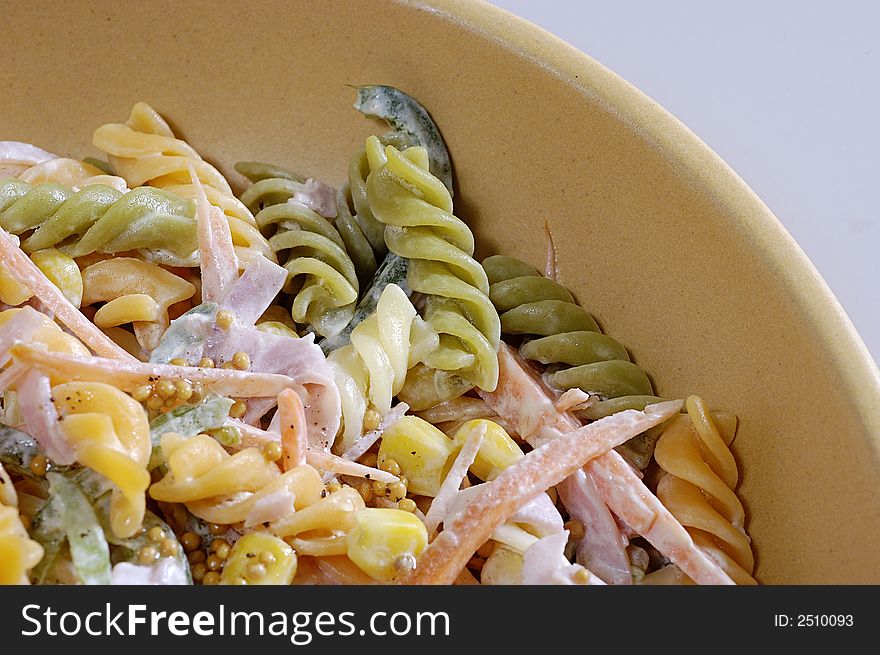 Picture of dish of pasta with ham, carrot and cheese. Picture of dish of pasta with ham, carrot and cheese.