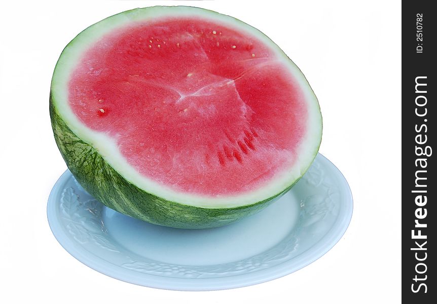 Close-up of half a watermelon over white background, with clipping path included. Close-up of half a watermelon over white background, with clipping path included.