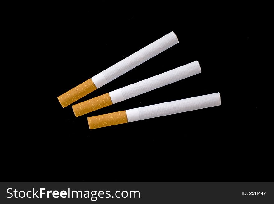 Isolated photo of three unsmoked cigarettes. Non resised. Isolated photo of three unsmoked cigarettes. Non resised.