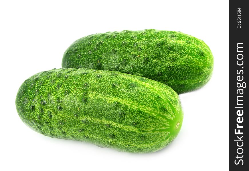 Two fresh cucumbers, isolated on a white background. Two fresh cucumbers, isolated on a white background.