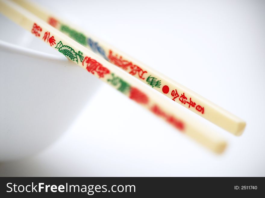 Japanese or chinese chopstick with a white rice bowl