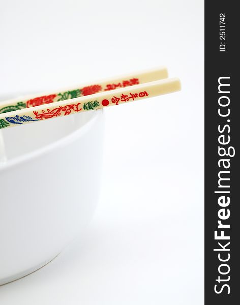 Japanese or chinese chopstick with a white bowl