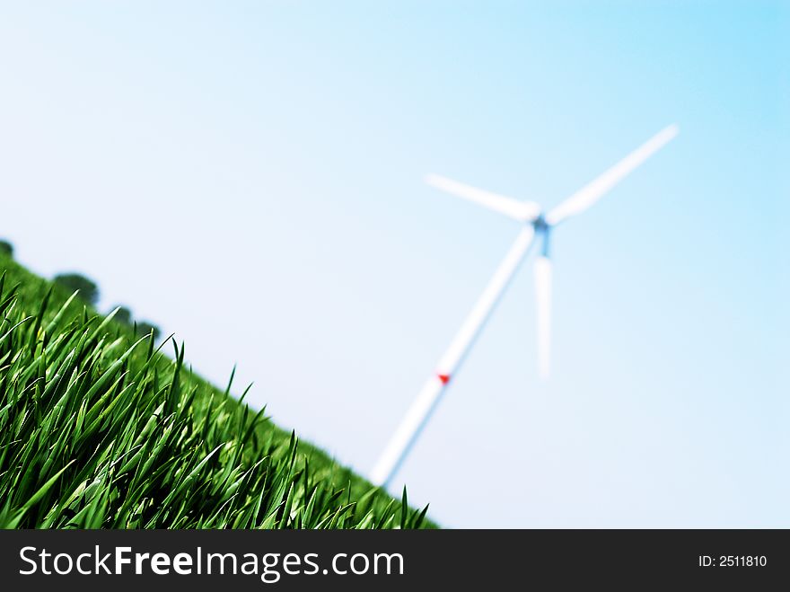 Wind turbine in a green wheat  field