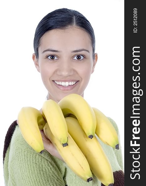 Smiling girl holding bananas in her hands. Smiling girl holding bananas in her hands