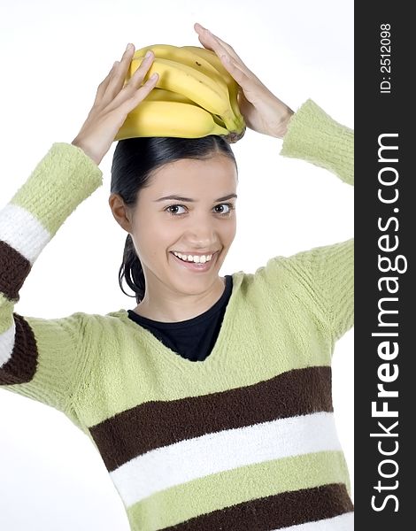 Smiling girl holding bananas in her hands. Smiling girl holding bananas in her hands