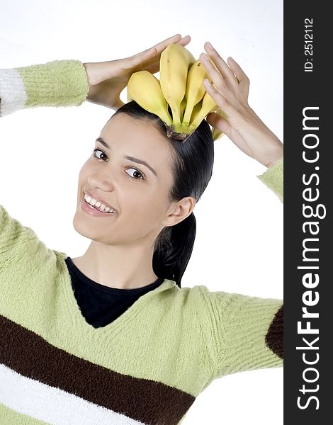 Smiling girl holding bananas in her hands. Smiling girl holding bananas in her hands