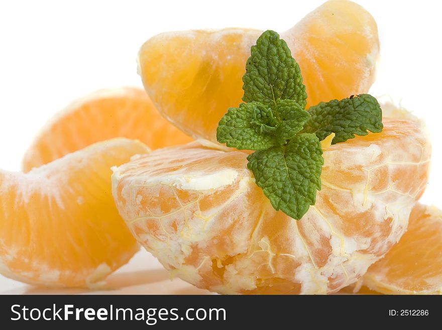 Slices of mandarin fruit and mint leaf. Slices of mandarin fruit and mint leaf