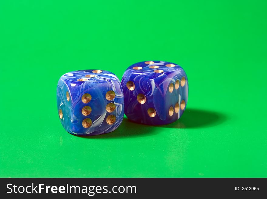 Two blue dices on green