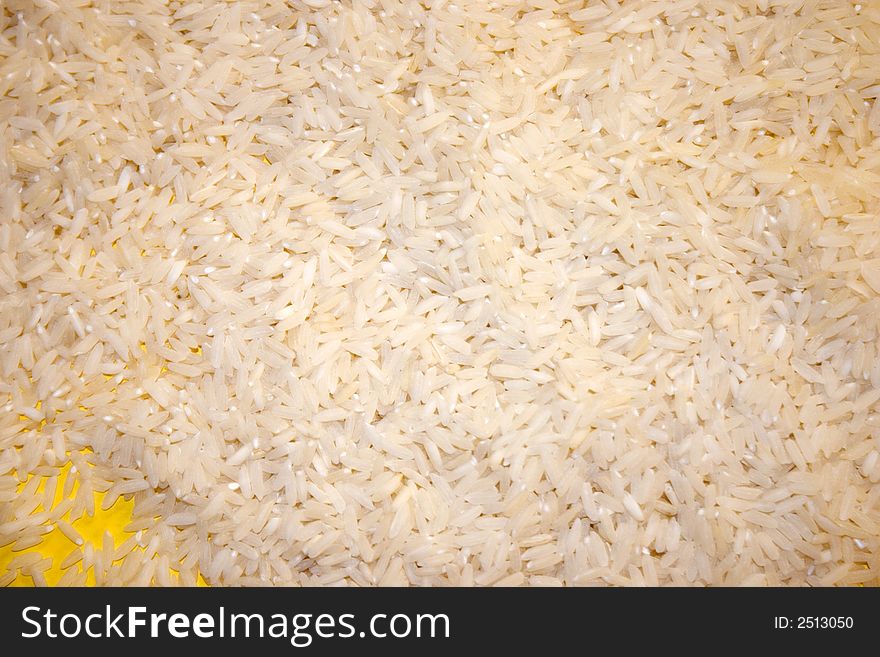 A background of rice with yellow beneath