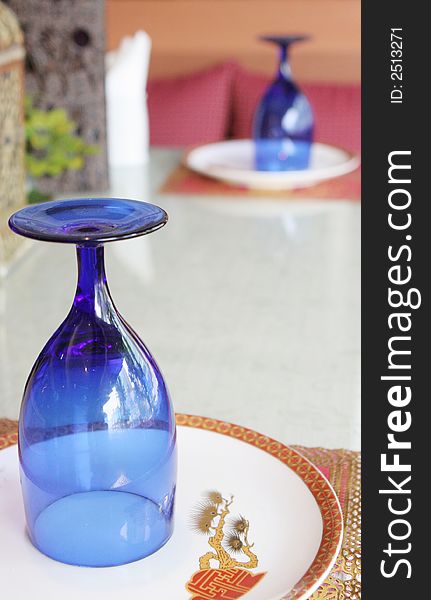 Blue colored glasses on a table setting