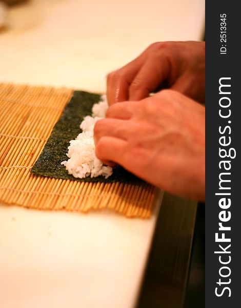 Sushi Chef Preparing California Roll. Sushi Chef Preparing California Roll