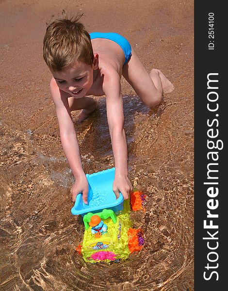 Playing boy on the beach