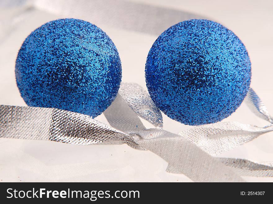 Two balls of blue color and silvery tape, New Year's toy. Two balls of blue color and silvery tape, New Year's toy