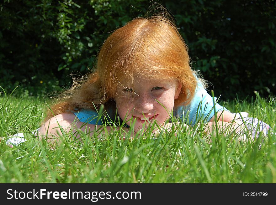 Girl laying in the grass