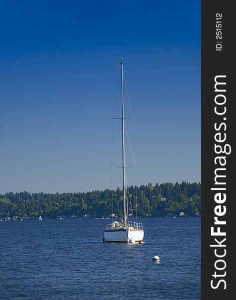 Sailboat moored offshore on Lake Washington near Seattle, WA. Sailboat moored offshore on Lake Washington near Seattle, WA
