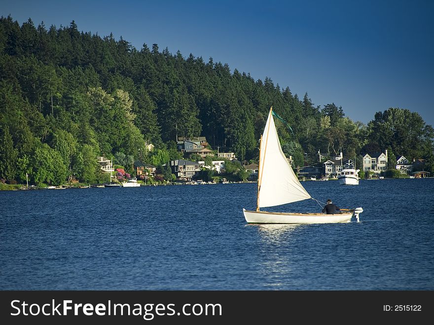 Gentleman sailing on Lake Washington on a warm spring afternoon. Gentleman sailing on Lake Washington on a warm spring afternoon