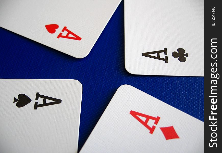Four aces (spade, diamond, heart, club) on blue