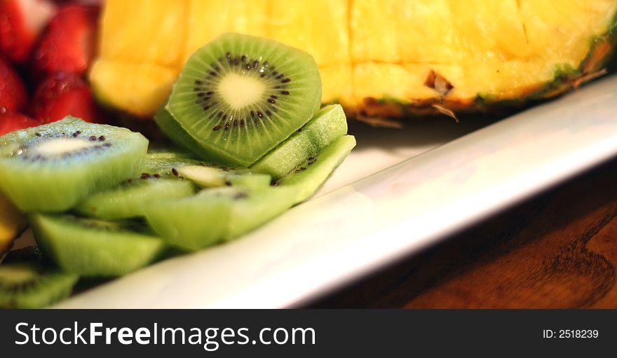 Fruit Dish with Pineapples, Kiwi, and Strawberries. Fruit Dish with Pineapples, Kiwi, and Strawberries