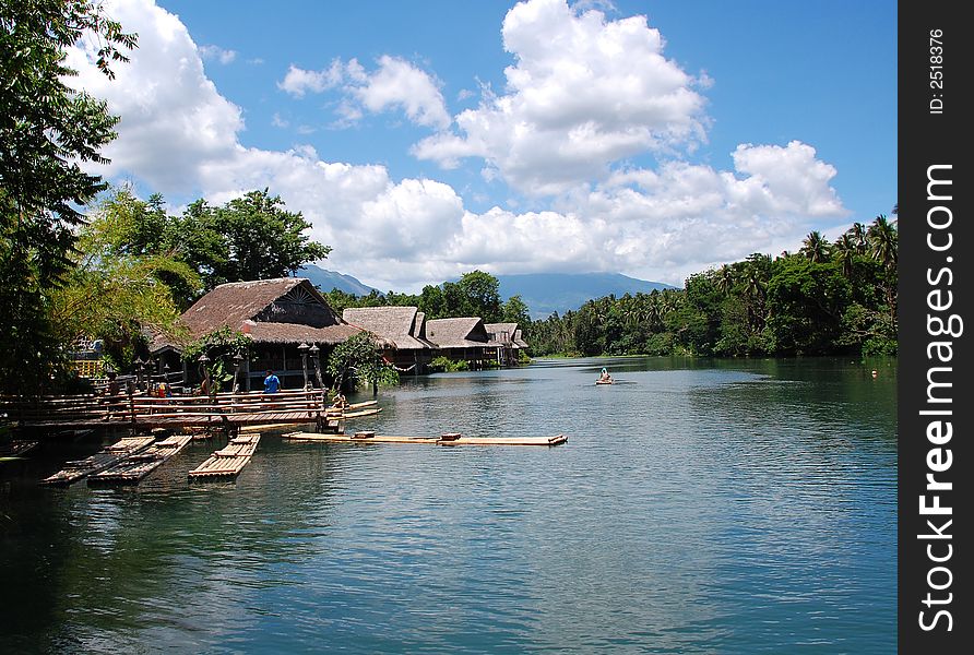 River view with traditional nipa huts. River view with traditional nipa huts