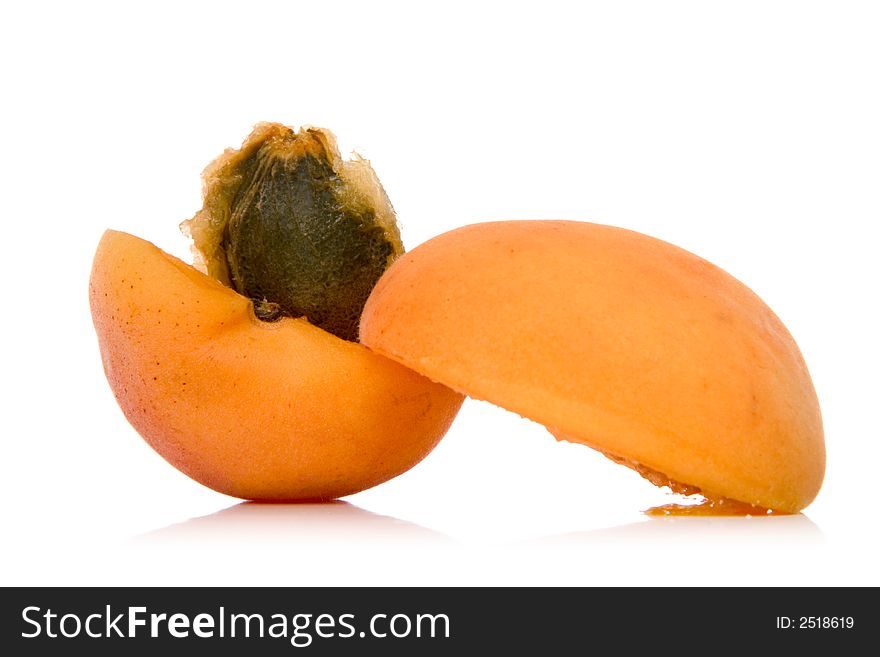 Sliced apricot isolated over white background