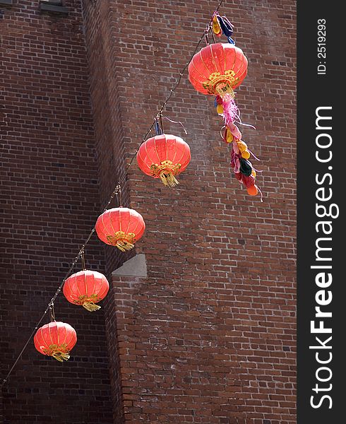 Chinese lanterns strung above the street outside a shop in the Chinatown area of San Francisco