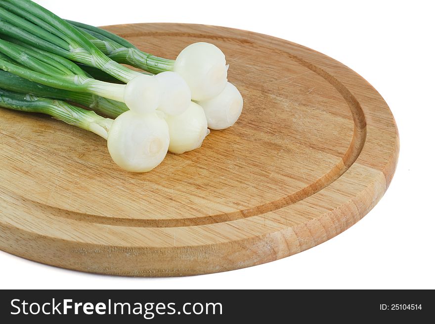 Green Onions On A Wooden  Board