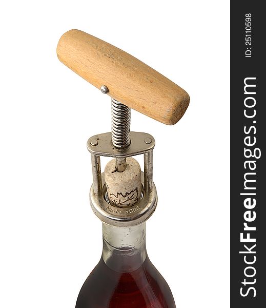 Closeup of bottle of vine with corkscrew on white background