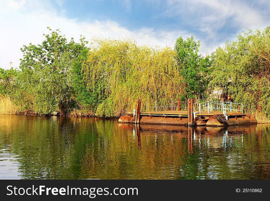 Floating moorage in the river over beautiful landscape