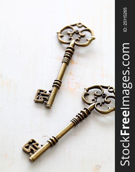 Close up of antique keys on white background