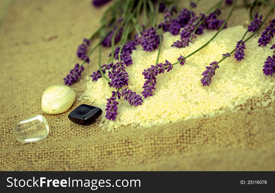 Black, whiteand transparent pebbles stones and lavender flowers. Black, whiteand transparent pebbles stones and lavender flowers