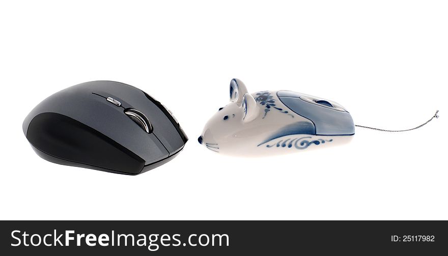 Grey wireless computer mouse and Russian Gzhel toy computer mouse isolated on white. Grey wireless computer mouse and Russian Gzhel toy computer mouse isolated on white