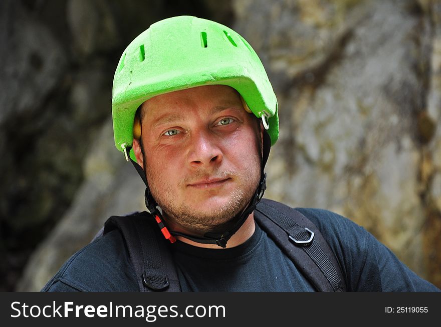 Portrait of a climber with a green helmet. Portrait of a climber with a green helmet