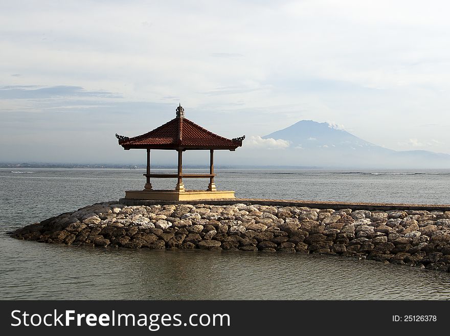 Small pagoda and mountain in remoteness in Bali. Small pagoda and mountain in remoteness in Bali.