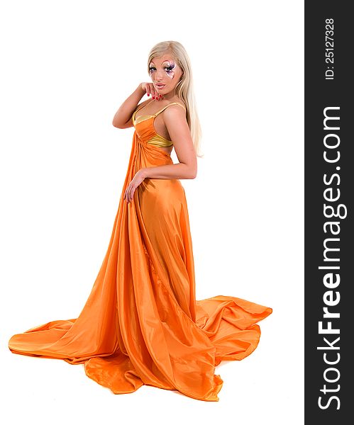 Girl in a flying orange fabric on a white background