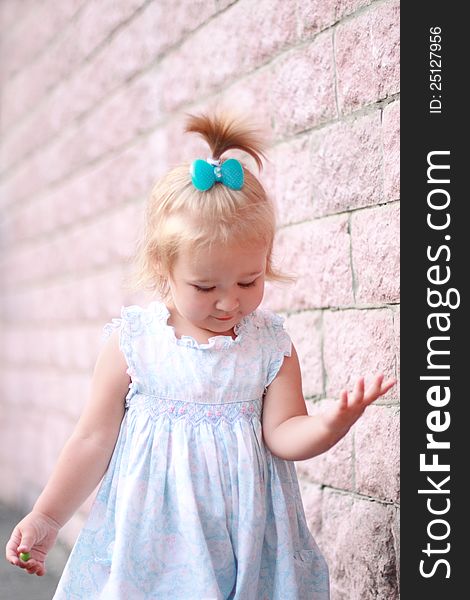 Portrait of the pretty smiling little girl