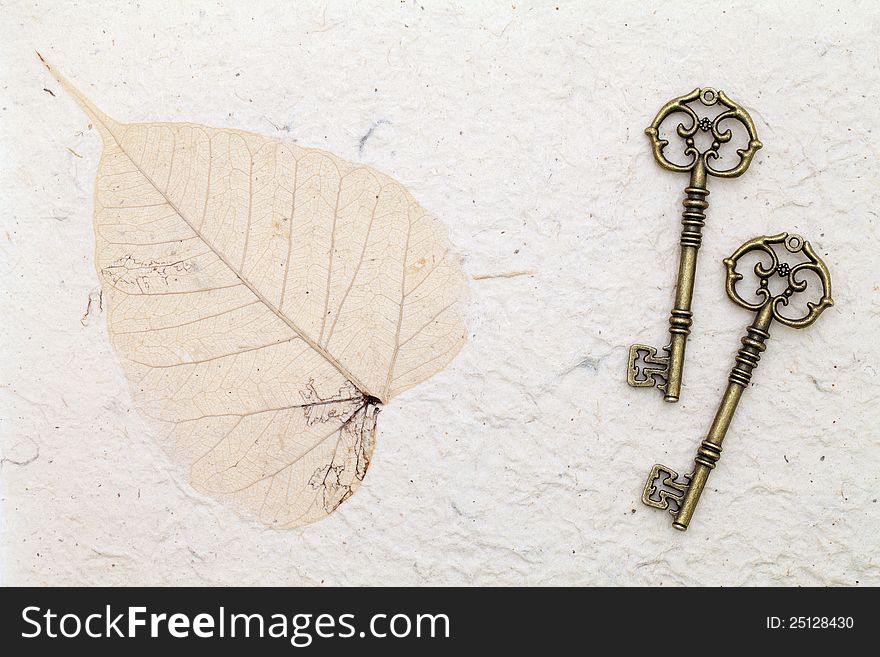 Antique keys on handmade rice paper
