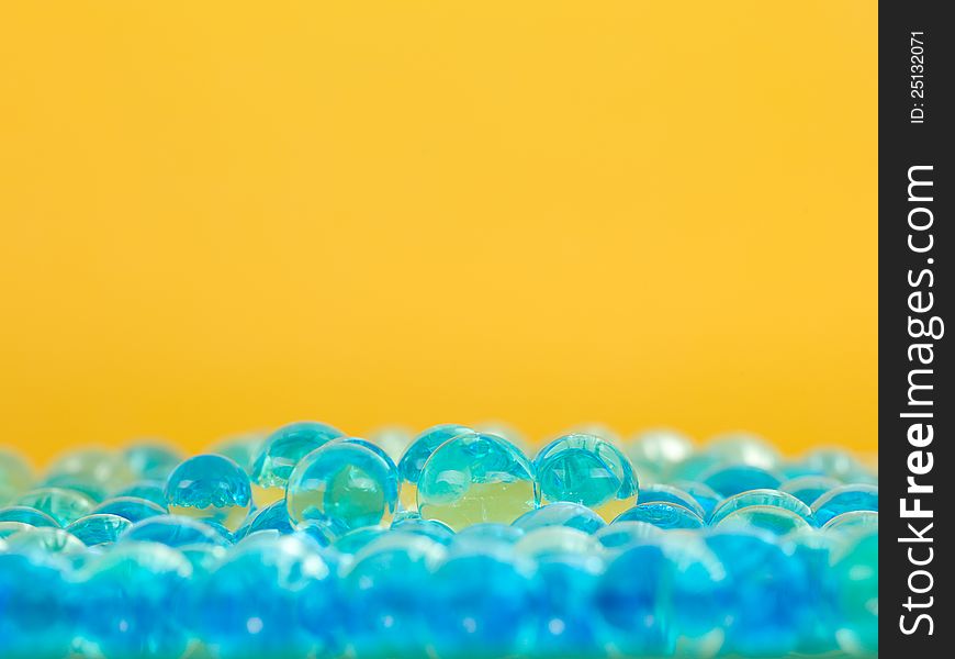 Translucent blue balls yellow background