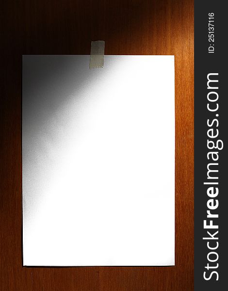 White paper on wooden background
